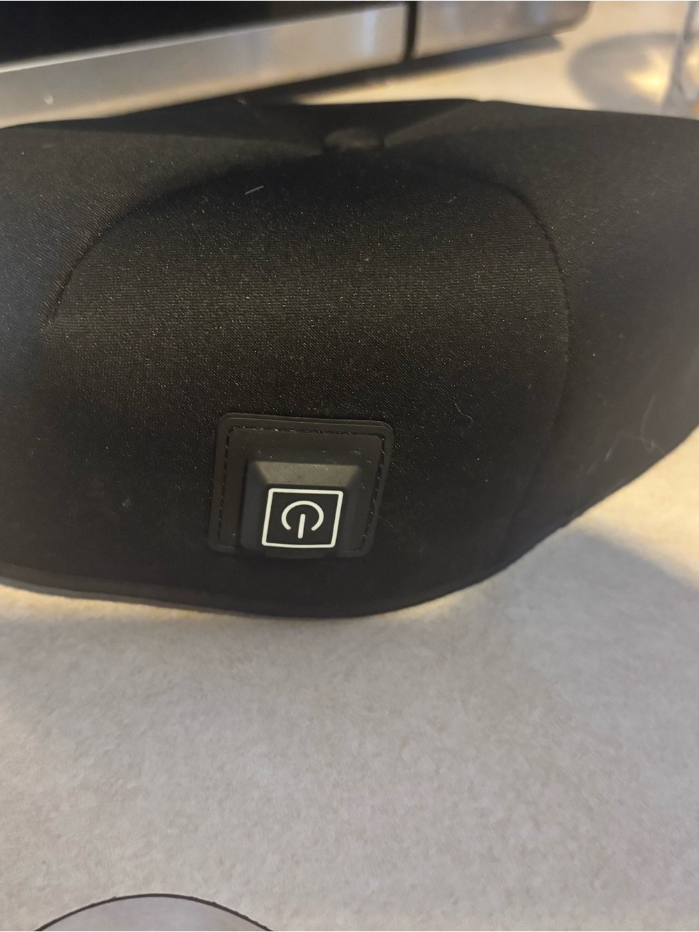 Black Red Light Therapy Cap, needs to be plugged in, hold power button to work